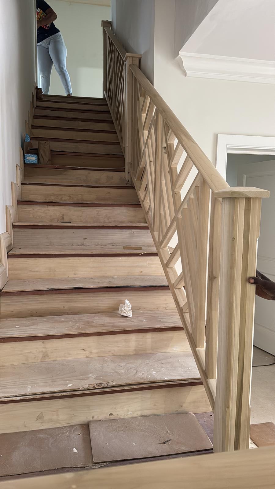 Chippendale pattern stair railing built in place, before finishing.