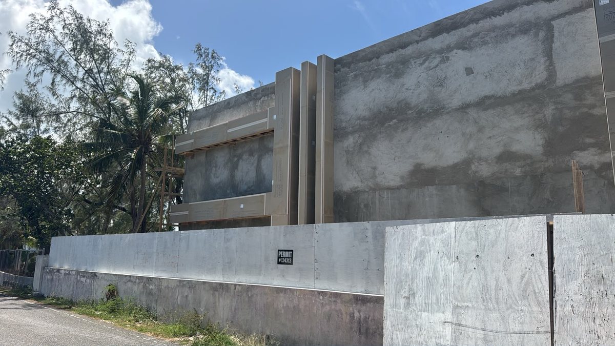 Street elevation of the concrete structure with cement board going on.