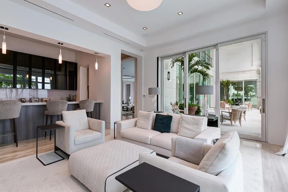 Open living and kitchen area with sliding doors onto a planted courtyard.